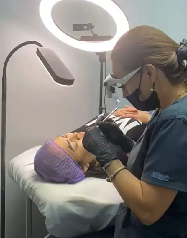 Sindy Glow Pro brow artist working on a client in West Houston